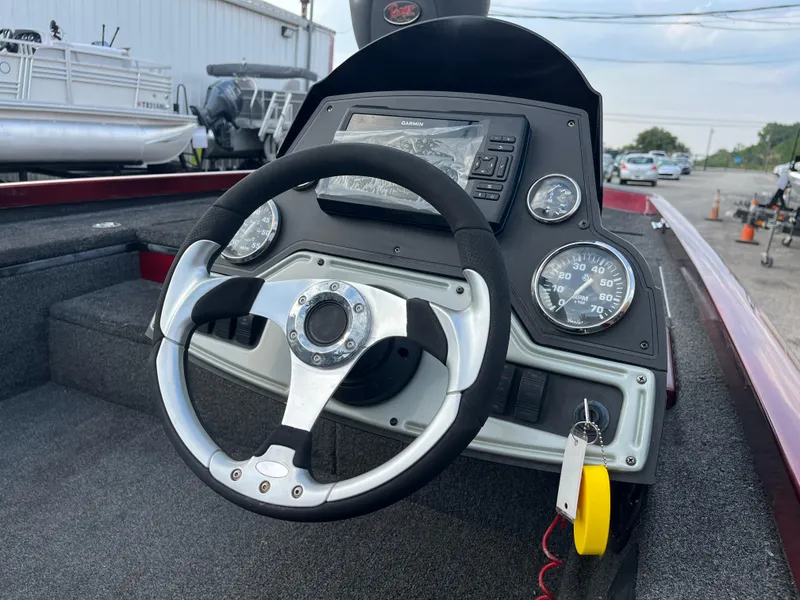 Slide: The Image of 2016 Ranger RT 178 Tournament edition boat dashboard with steering wheel and gauges. - 36