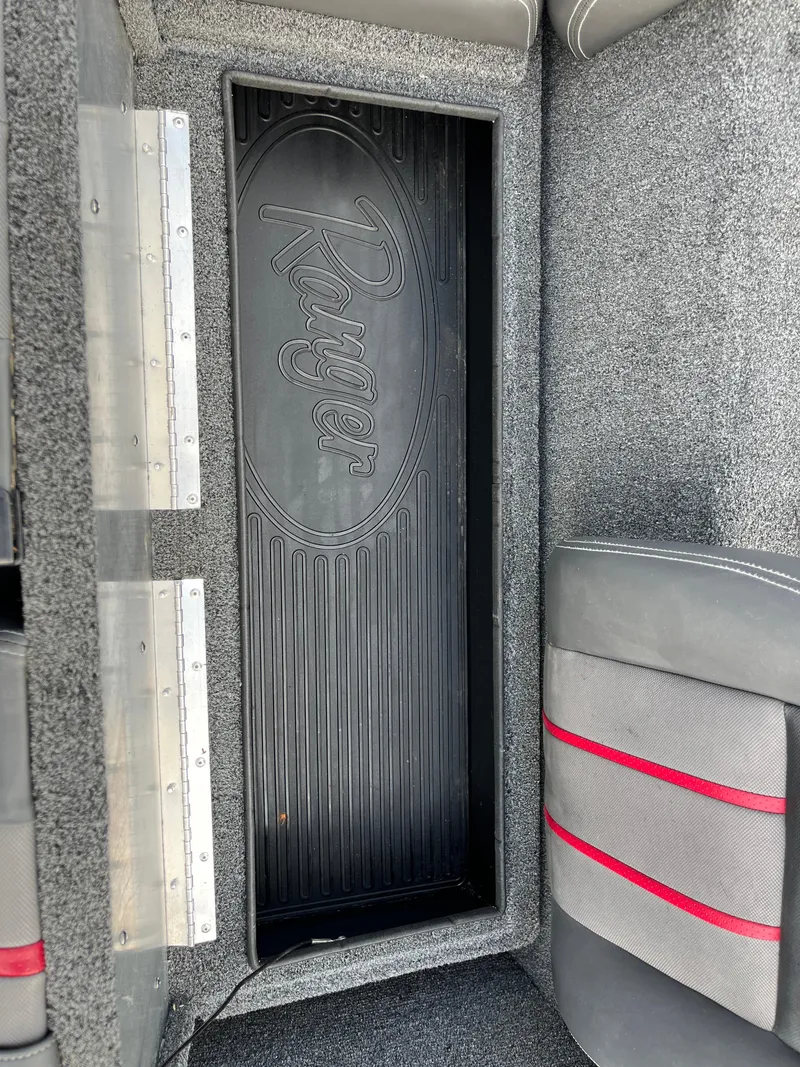 Slide: The Image of 2016 Ranger RT 178 Tournament edition boat interior with storage compartment and seating. - 48