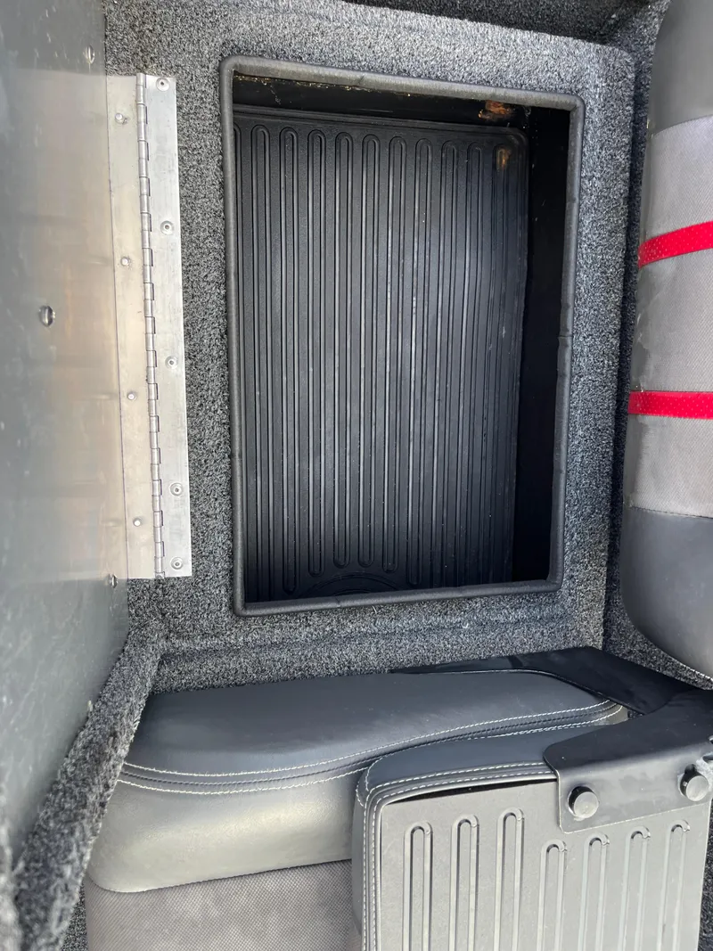 Slide: The Image of 2016 Ranger RT 178 Tournament edition boat storage compartment with textured interior. - 49