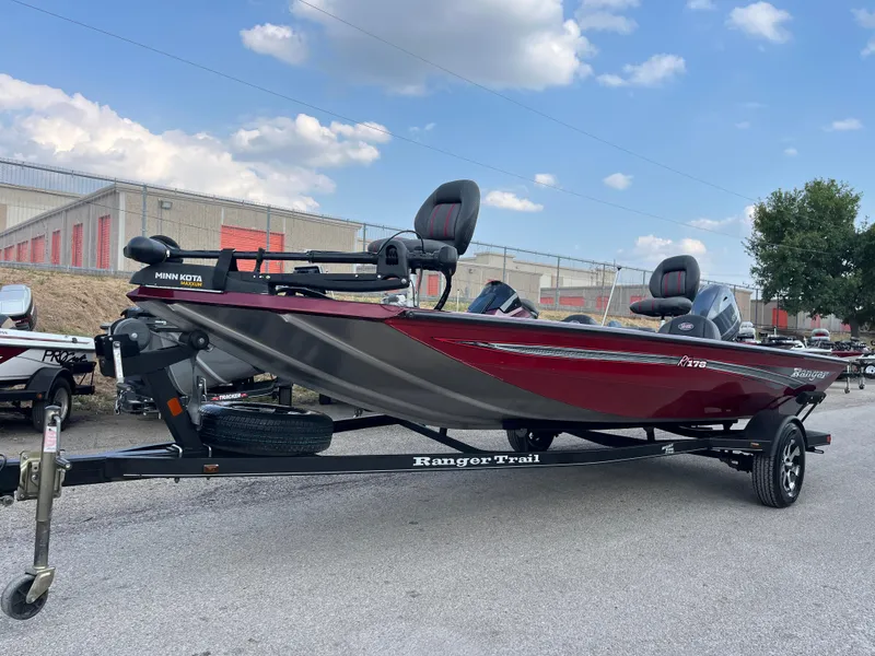 Slide: The Image of 2016 Ranger RT 178 Tournament Edition boat on trailer, red and gray, outdoor setting. - 6