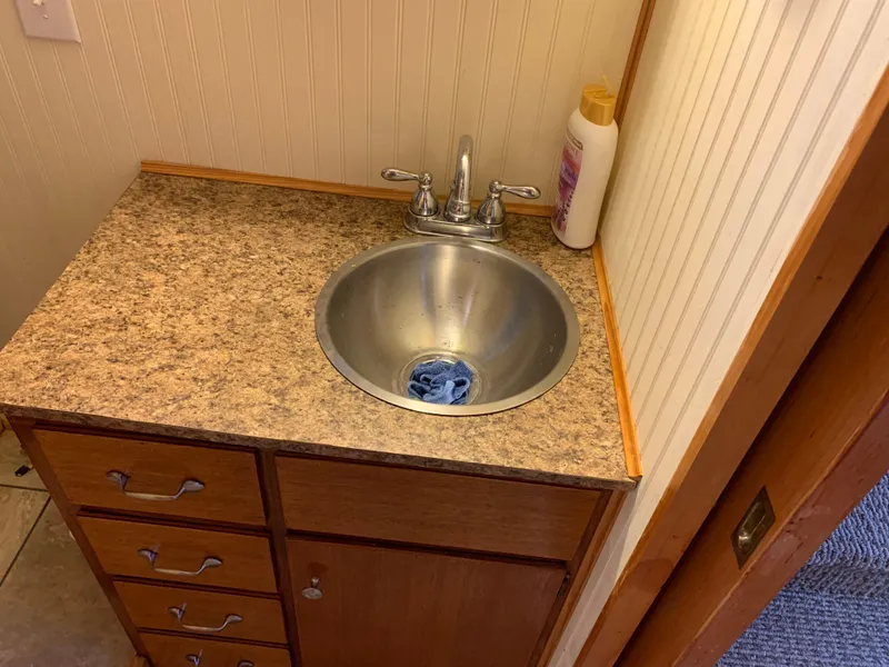 Slide: The Image of Compact bathroom sink with wooden cabinet, Lazy Days Custom 1965 model. - 15