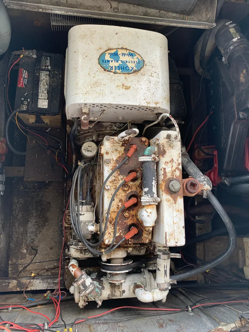 Slide: The Image of 1965 Lazy Days Custom engine with visible wiring and components in a boat. - 25