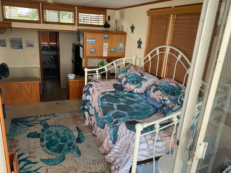 Slide: The Image of Cozy 1965 Lazy Days Custom interior with sea turtle-themed decor and wooden accents. - 4