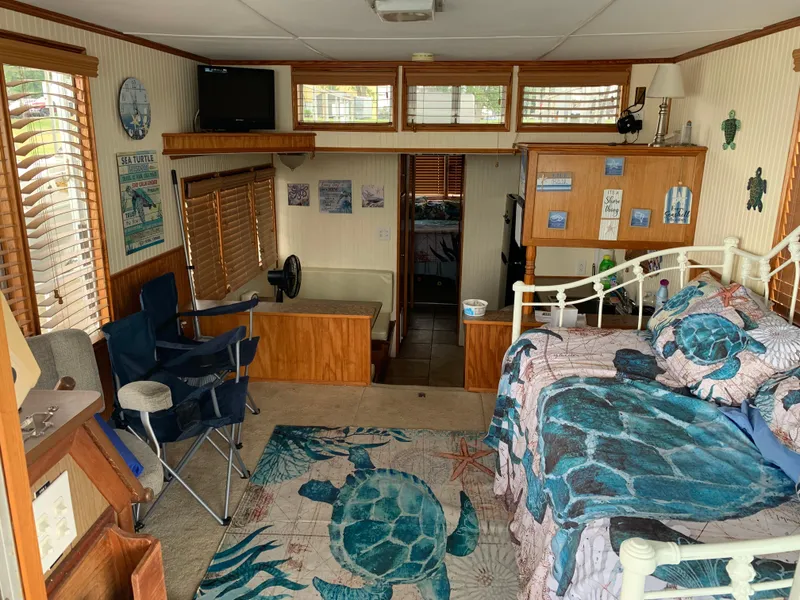 Slide: The Image of Cozy 1965 Lazy Days Custom interior with turtle-themed decor and wooden accents. - 5