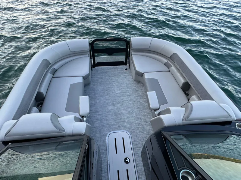 Slide: The Image of 2024 Premier 250 Solaris boat with spacious seating on calm water. - 16
