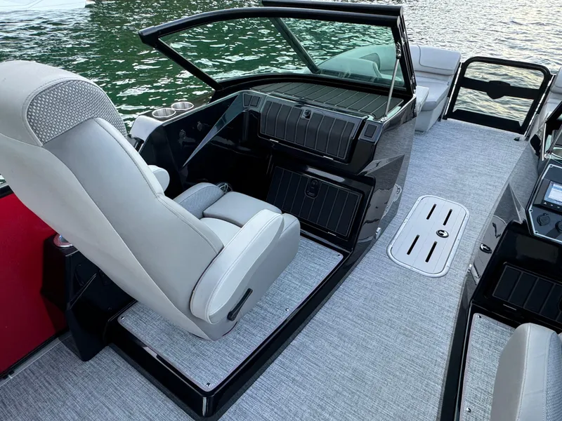 Slide: The Image of 2024 Premier 250 Solaris boat interior with modern seating and sleek dashboard design. - 20