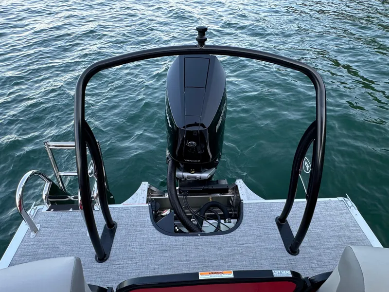 Slide: The Image of 2024 Premier 250 Solaris boat with outboard motor on water. - 24