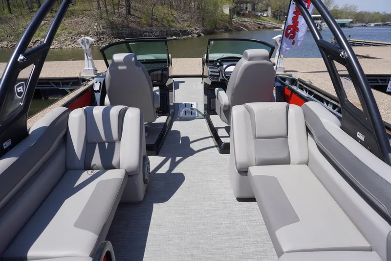Slide: The Image of 2024 Premier 250 Solaris pontoon boat interior with plush seating and modern design. - 9