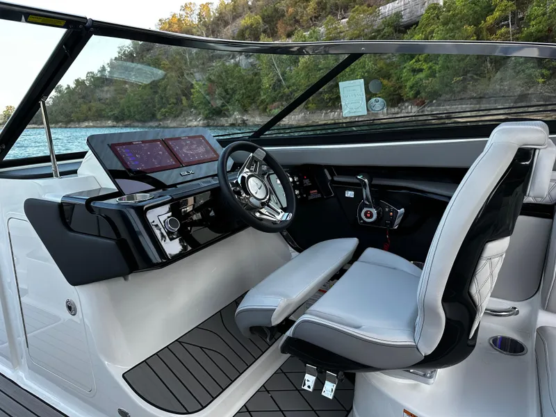 Slide: The Image of 2025 Sea Ray SLX 260 boat cockpit with modern controls and sleek design. - 16