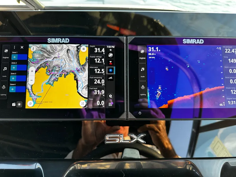 Slide: The Image of Simrad navigation display on 2025 Sea Ray SLX 260 boat dashboard. - 19