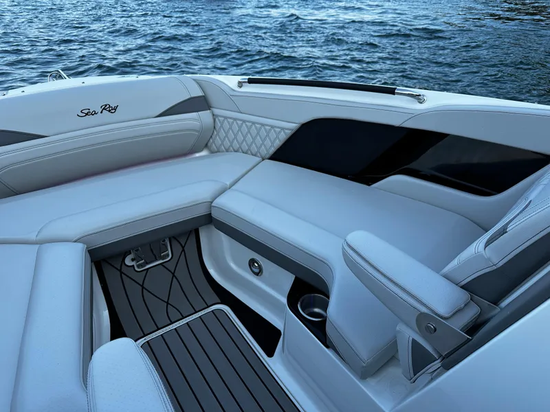 Slide: The Image of Luxurious seating on 2025 Sea Ray SLX 260 boat with elegant design and water backdrop. - 8