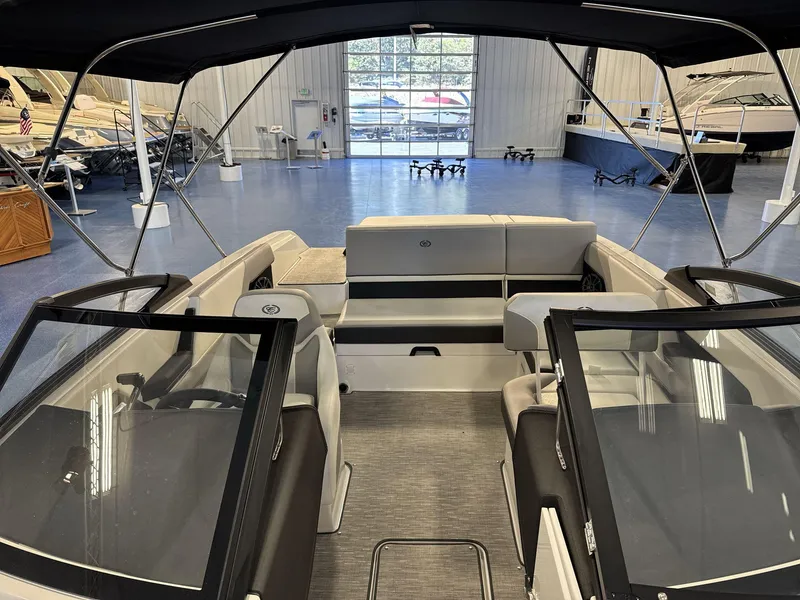 Slide: The Image of 2025 Cobalt CS22 boat interior in showroom, featuring sleek seating and modern design. - 10
