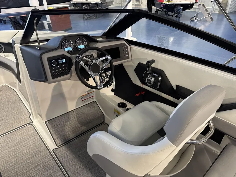 Slide: The Image of 2025 Cobalt CS22 boat interior with modern dashboard and steering wheel. - 11