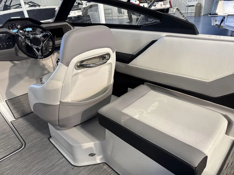 Slide: The Image of 2025 Cobalt CS22 boat interior with modern steering wheel and seating. - 16