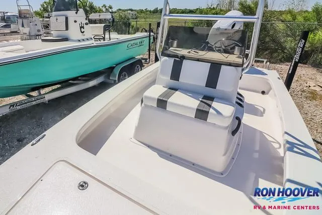 Slide: The Image of 2024 Majek Boats 18 M2 displayed in showroom with Suzuki engine. - 8