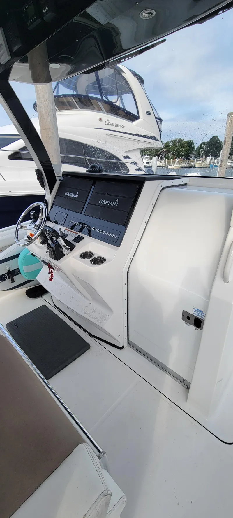 Slide: The Image of 2018 Edgewater 370CC boat cockpit with modern navigation system and sleek design. - 7