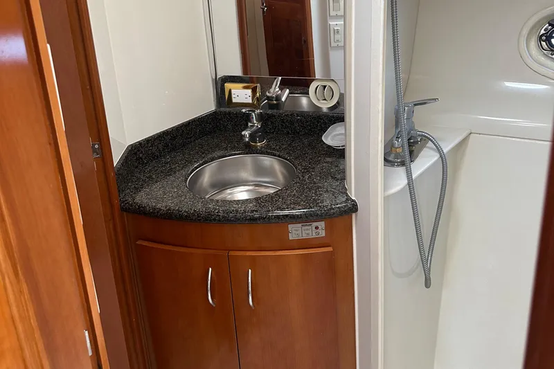 Slide: The Image of 2004 Carver 420 Mariner bathroom with sink, granite countertop, and shower. - 23