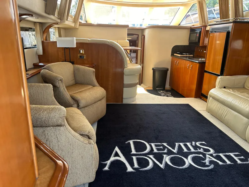 Slide: The Image of Luxurious interior of 2004 Carver 420 Mariner yacht with plush seating and stylish decor. - 3