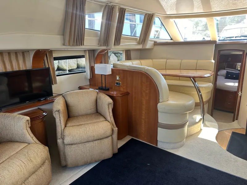Slide: The Image of Luxurious interior of 2004 Carver 420 Mariner yacht with plush seating and modern amenities. - 5