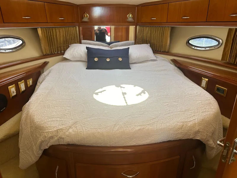 Slide: The Image of Luxurious bedroom interior of 2004 Carver 420 Mariner yacht with elegant wood finish. - 8