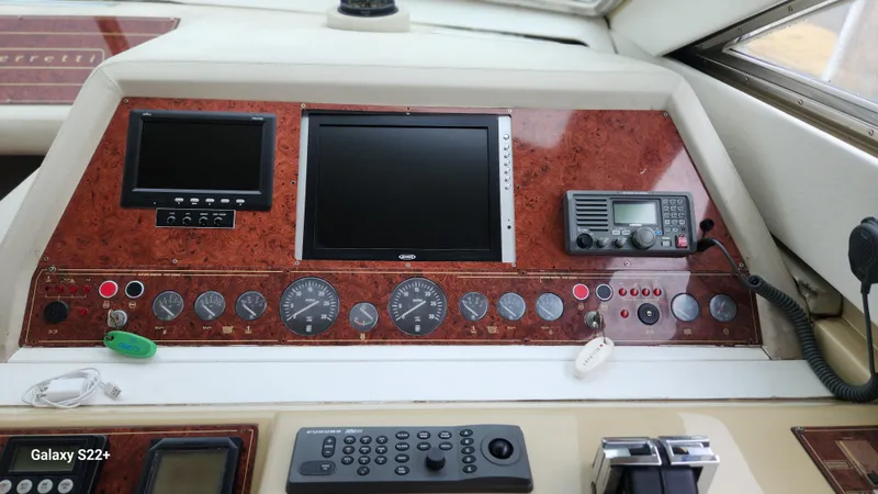 Slide: The Image of Control panel of a 1998 Ferretti Yachts 55 Motor Yacht with navigation instruments. - 12
