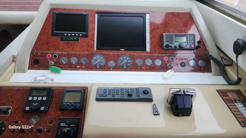 Slide: The Image of Control panel of a 1998 Ferretti Yachts 55 Motor Yacht with navigation instruments. - 13