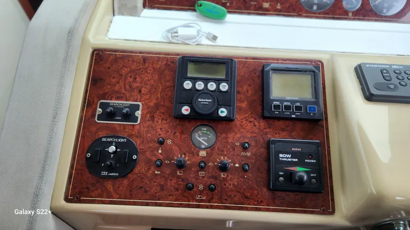 Slide: The Image of Control panel of a 1998 Ferretti Yachts 55 Motor Yacht with various instruments. - 14