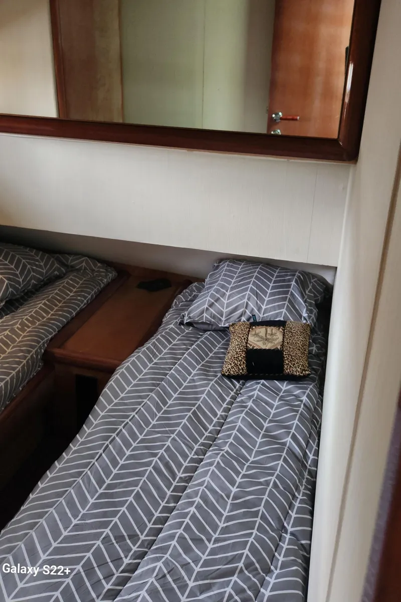 Slide: The Image of Cozy bedroom in 1998 Ferretti Yachts 55 Motor Yacht with patterned bedding. - 26