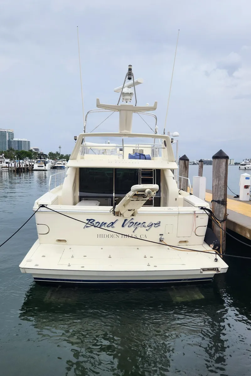 Slide: The Image of 1998 Ferretti Yachts 55 Motor Yacht docked at marina. - 31