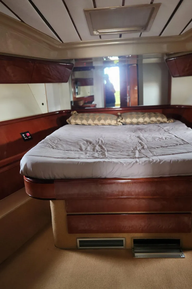 Slide: The Image of Luxurious cabin interior of 1998 Ferretti Yachts 55 Motor Yacht with elegant wood finish. - 34