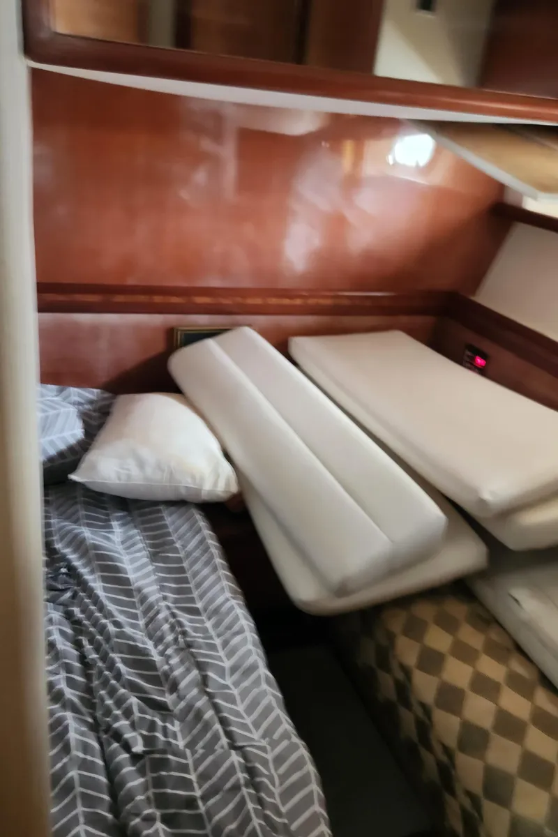 Slide: The Image of Cozy cabin interior of 1998 Ferretti Yachts 55 Motor Yacht with bedding and cushions. - 35