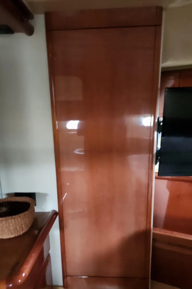 Slide: The Image of Interior of 1998 Ferretti Yachts 55 Motor Yacht with wooden cabinetry. - 36