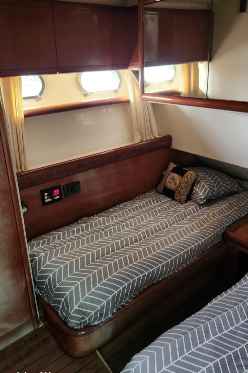 Slide: The Image of Cozy cabin interior of 1998 Ferretti Yachts 55 Motor Yacht with twin beds. - 41