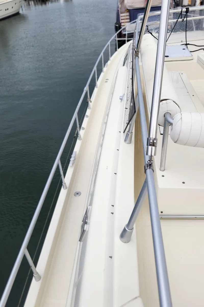 Slide: The Image of Side view of 1998 Ferretti Yachts 55 Motor Yacht docked at marina. - 47