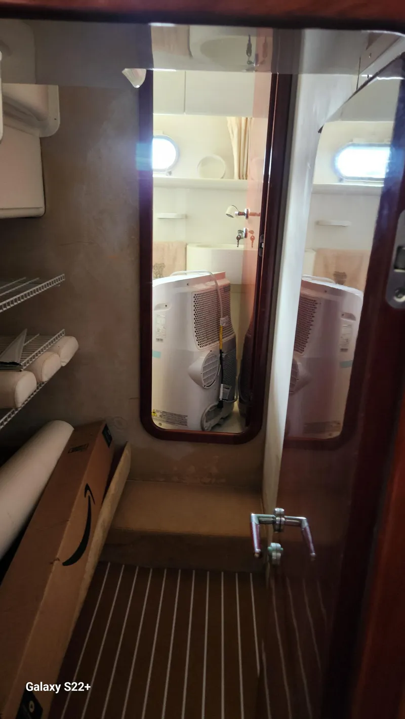 Slide: The Image of Interior of 1998 Ferretti Yachts 55 Motor Yacht with storage and appliances. - 5