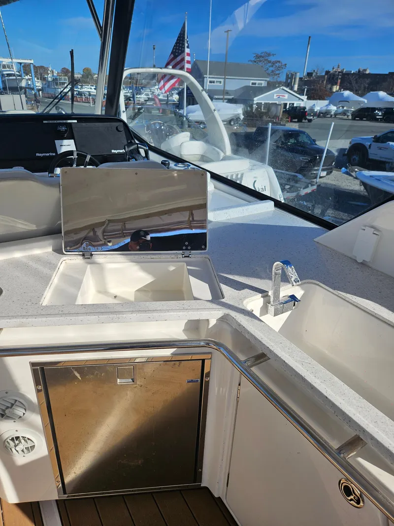 Slide: The Image of 2020 Aquila 36 Sport yacht interior with sink and stainless steel appliances. - 15