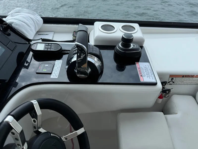 Slide: The Image of Aquila 36 Sport 2020 boat helm with controls and steering wheel. - 22