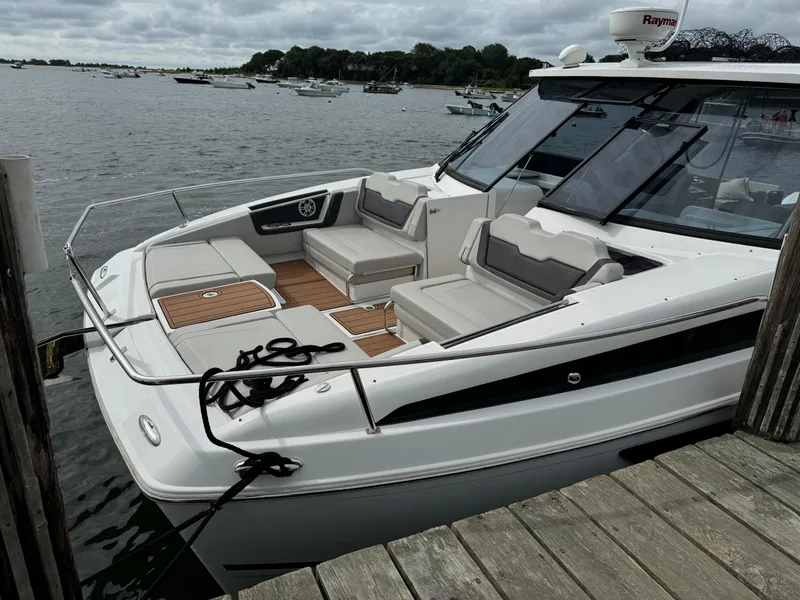 Slide: The Image of 2020 Aquila 36 Sport boat docked, featuring spacious seating and sleek design. - 3