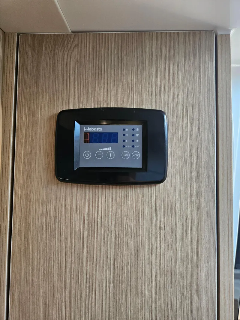 Slide: The Image of Control panel on Aquila 36 Sport 2020, mounted on wood paneling. - 40