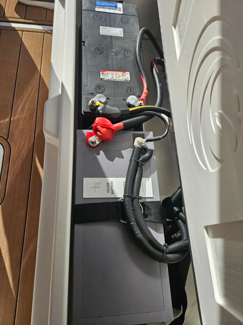 Slide: The Image of Battery compartment of 2020 Aquila 36 Sport boat, featuring secured wiring and connections. - 41
