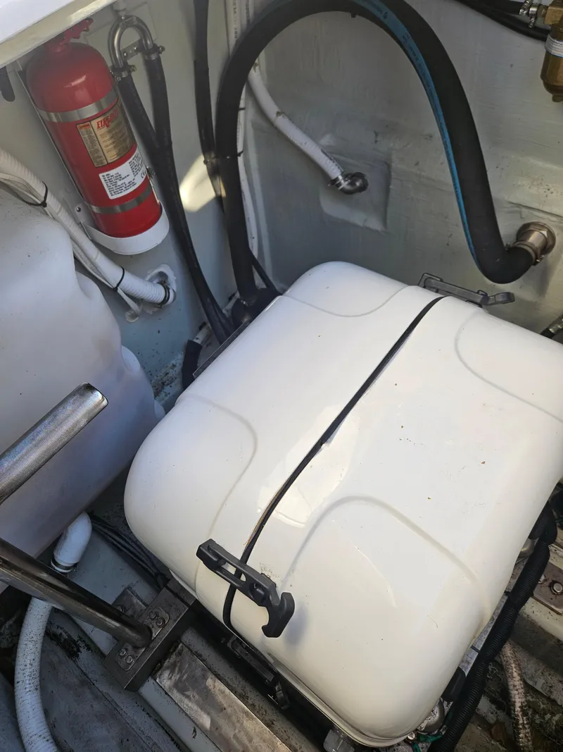 Slide: The Image of Engine compartment of 2020 Aquila 36 Sport with fire extinguisher and equipment. - 43