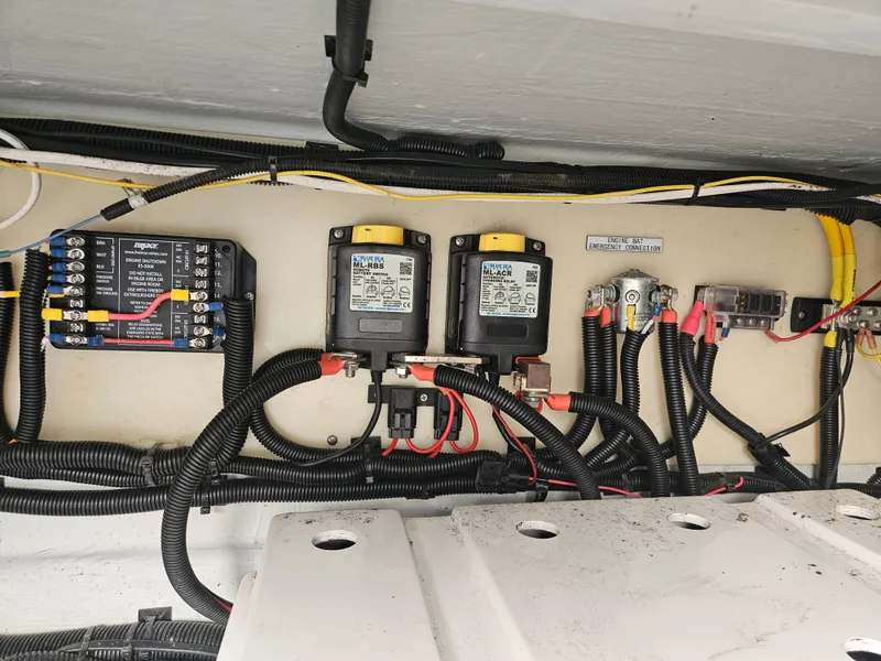 Slide: The Image of Electrical wiring and components inside a 2020 Aquila 36 Sport boat. - 44
