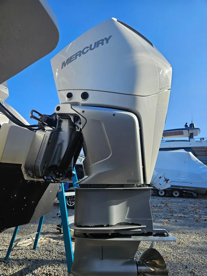 Slide: The Image of Mercury outboard motor on 2020 Aquila 36 Sport boat, parked outdoors. - 46