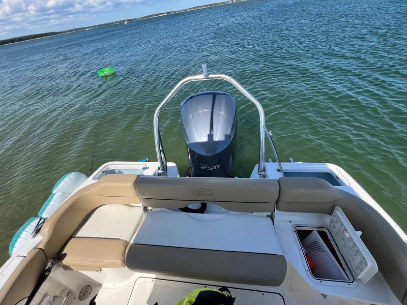 Slide: The Image of 2018 Pioneer 222 Islander boat with outboard motor on calm water. - 3