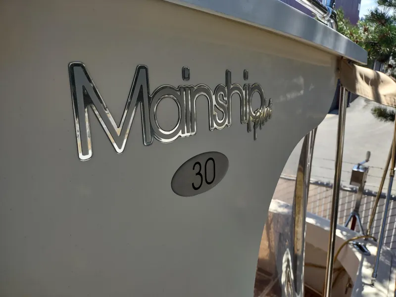 Slide: The Image of 2008 Mainship 30 Pilot II Sedan boat, close-up of logo and model number. - 15