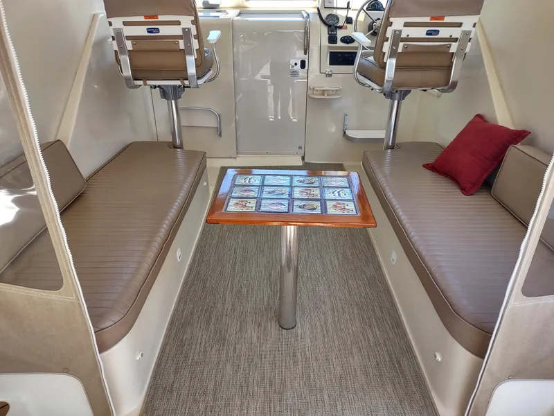 Slide: The Image of 2008 Mainship 30 Pilot II Sedan interior with seating and table. - 18