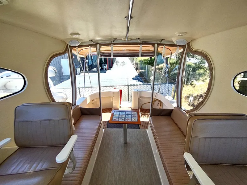 Slide: The Image of Interior of 2008 Mainship 30 Pilot II Sedan with seating and table. - 26