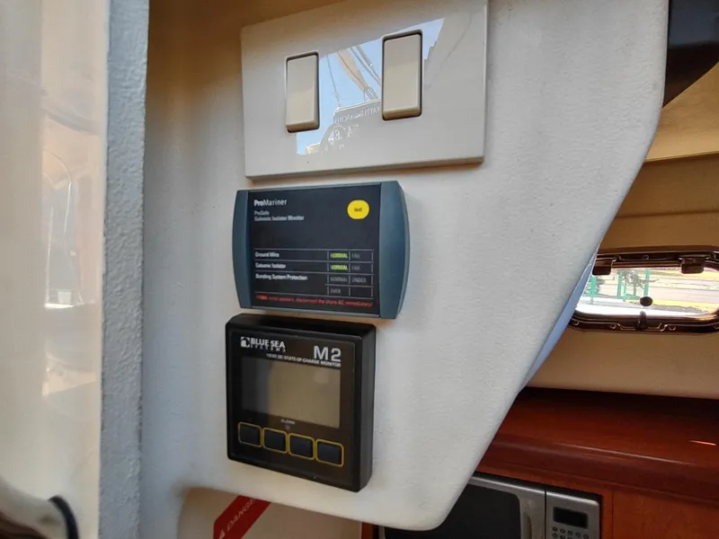 Slide: The Image of Control panel inside 2008 Mainship 30 Pilot II Sedan boat cabin. - 32
