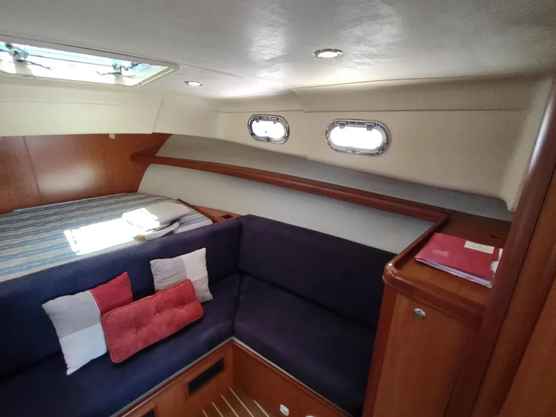 Slide: The Image of Interior of 2008 Mainship 30 Pilot II Sedan with cozy seating and bedding. - 35