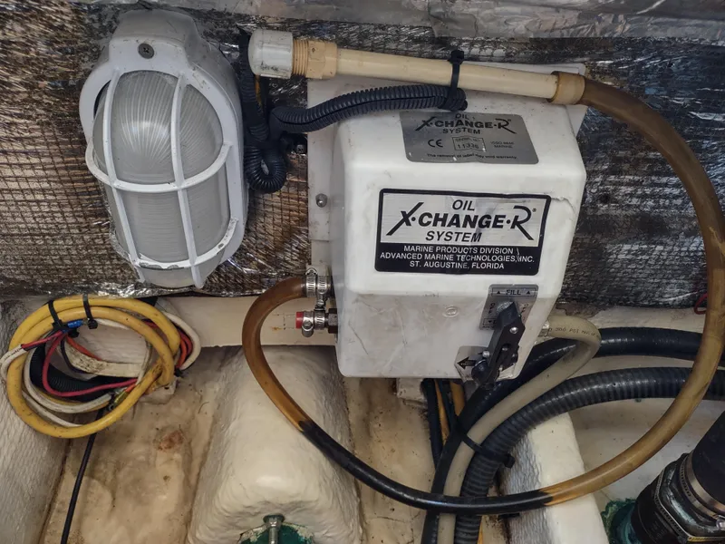 Slide: The Image of 2008 Mainship 30 Pilot II Sedan engine room with oil X-Change-R system. - 42